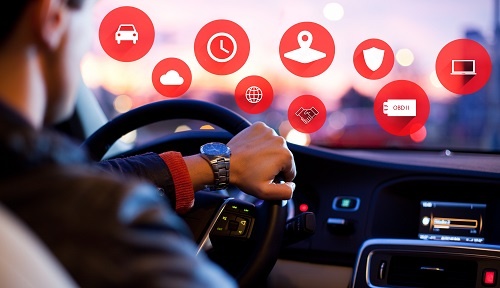 Concept image of driver interfacing with various telematics icons.