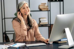 older woman receiving call using professional VOIP for customer service centers