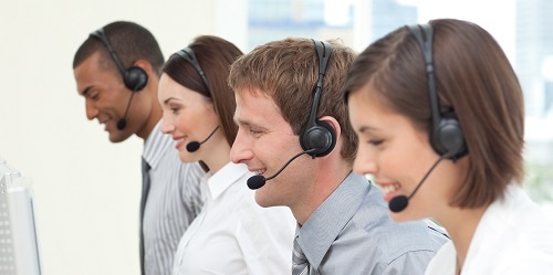 A row of operators answering calls in a call center. 